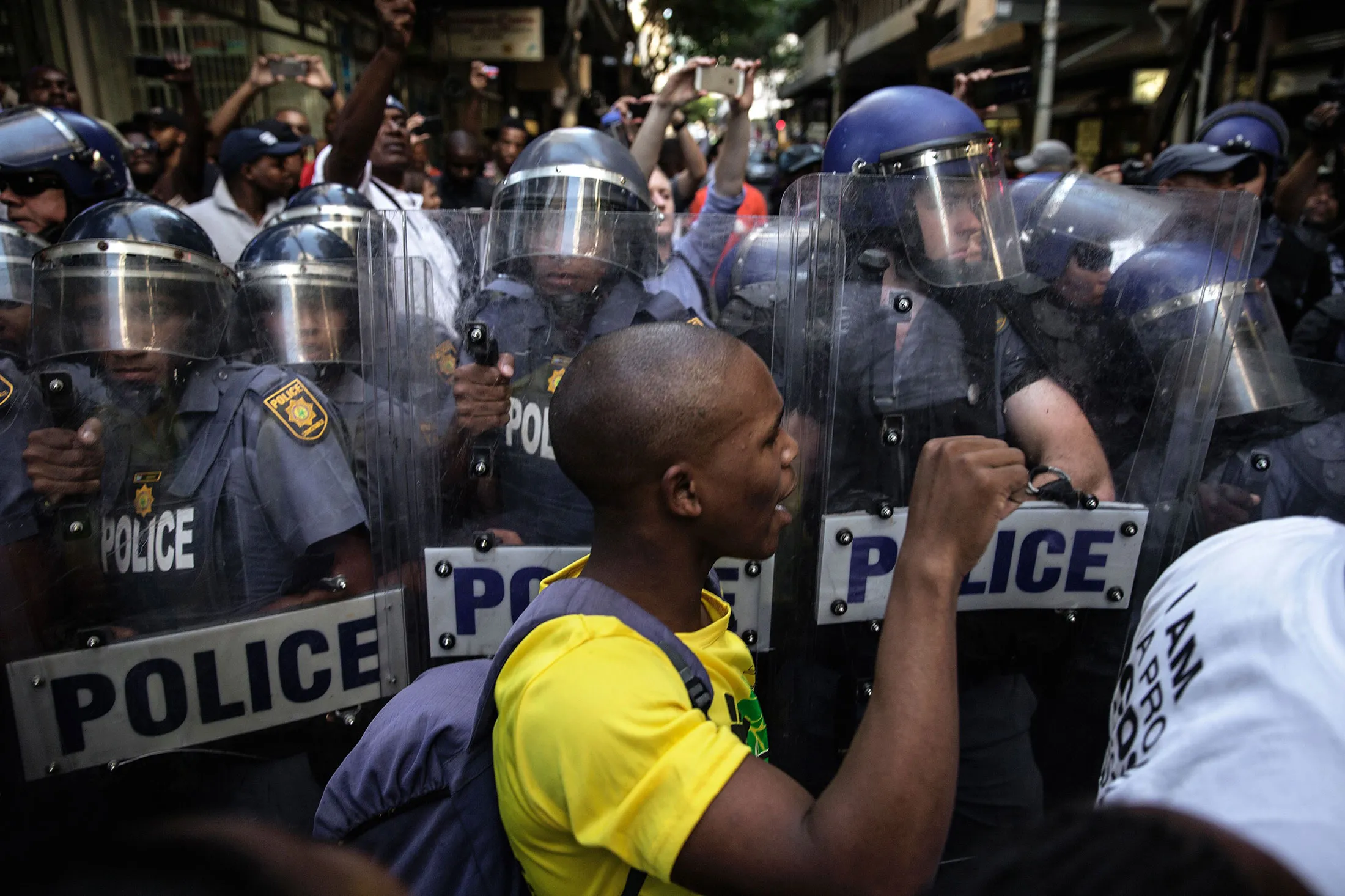 South African police scuffle with students from the South African Ruling party African National Congress (ANC) ahead of the annual state-of-the-nation address on Feb. 9, 2017, in Cape Town.
