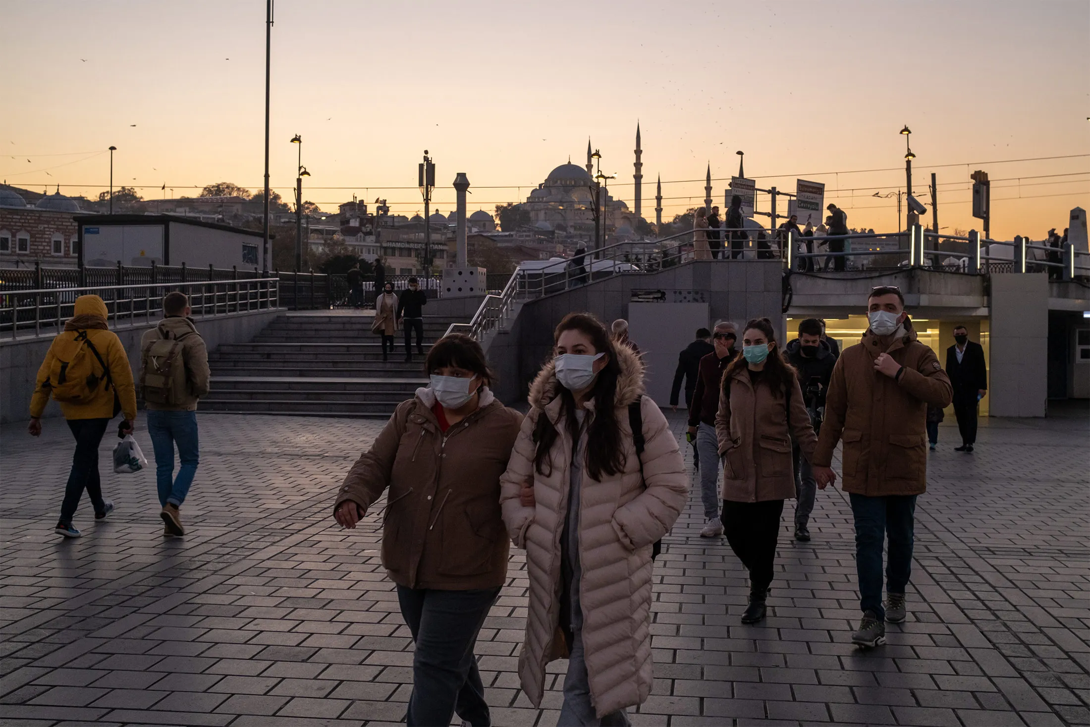 Pedestrians wear face masks in Istanbul on Nov. 30.