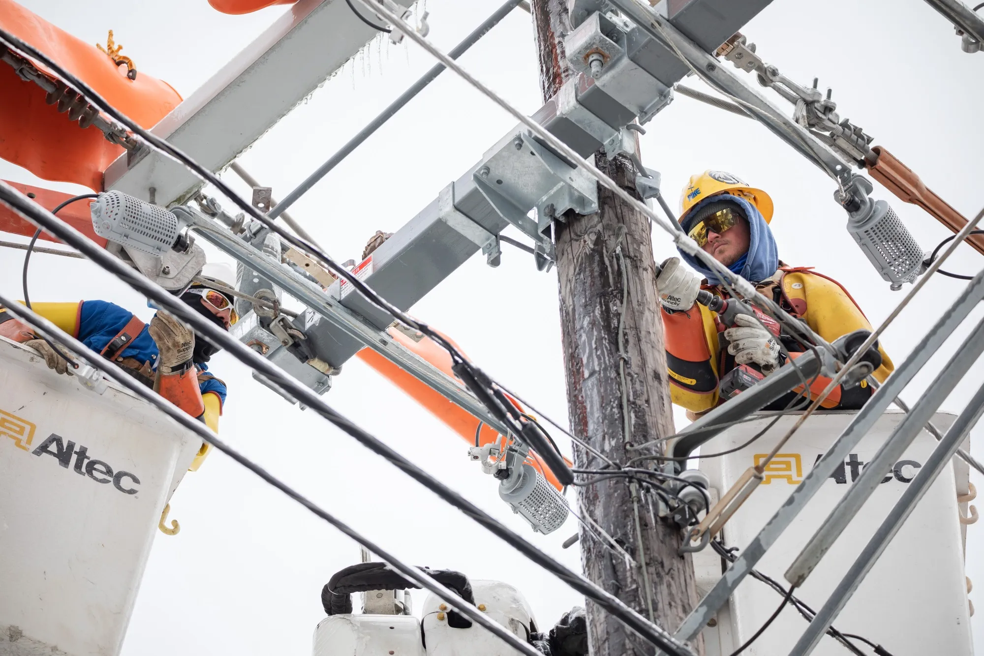Workers repair a power line in Austin, Texas, during the freeze in February.