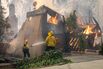 Thousands Flee From Uncontrolled Wildfires Burning Near LA