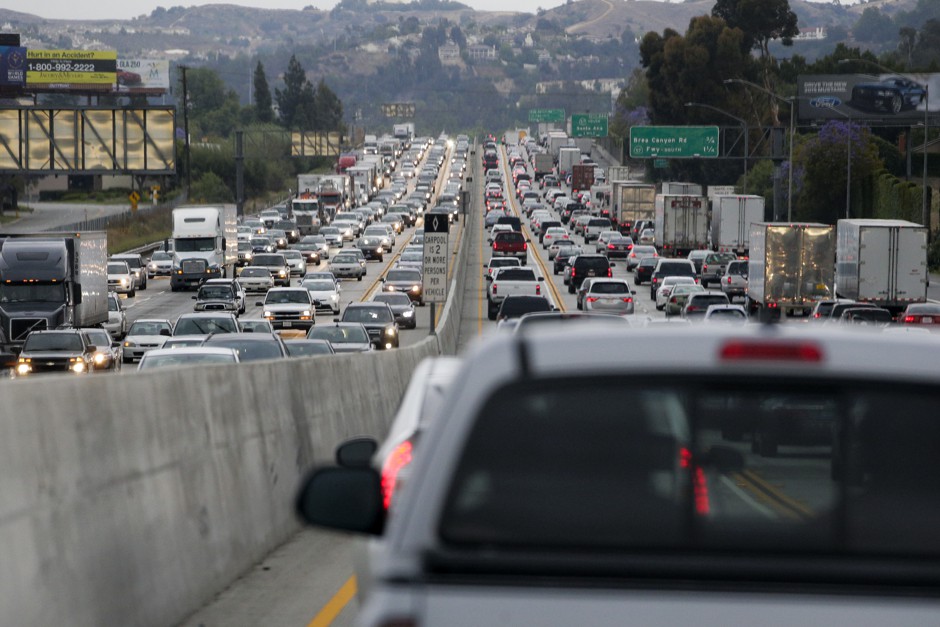 Cars crawl along the freeway during rush hour in Rowland Heights, Calif.