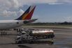 A jet fuel tanker near a Philippine Airlines jet at Ninoy Aquino International Airport in Manila.