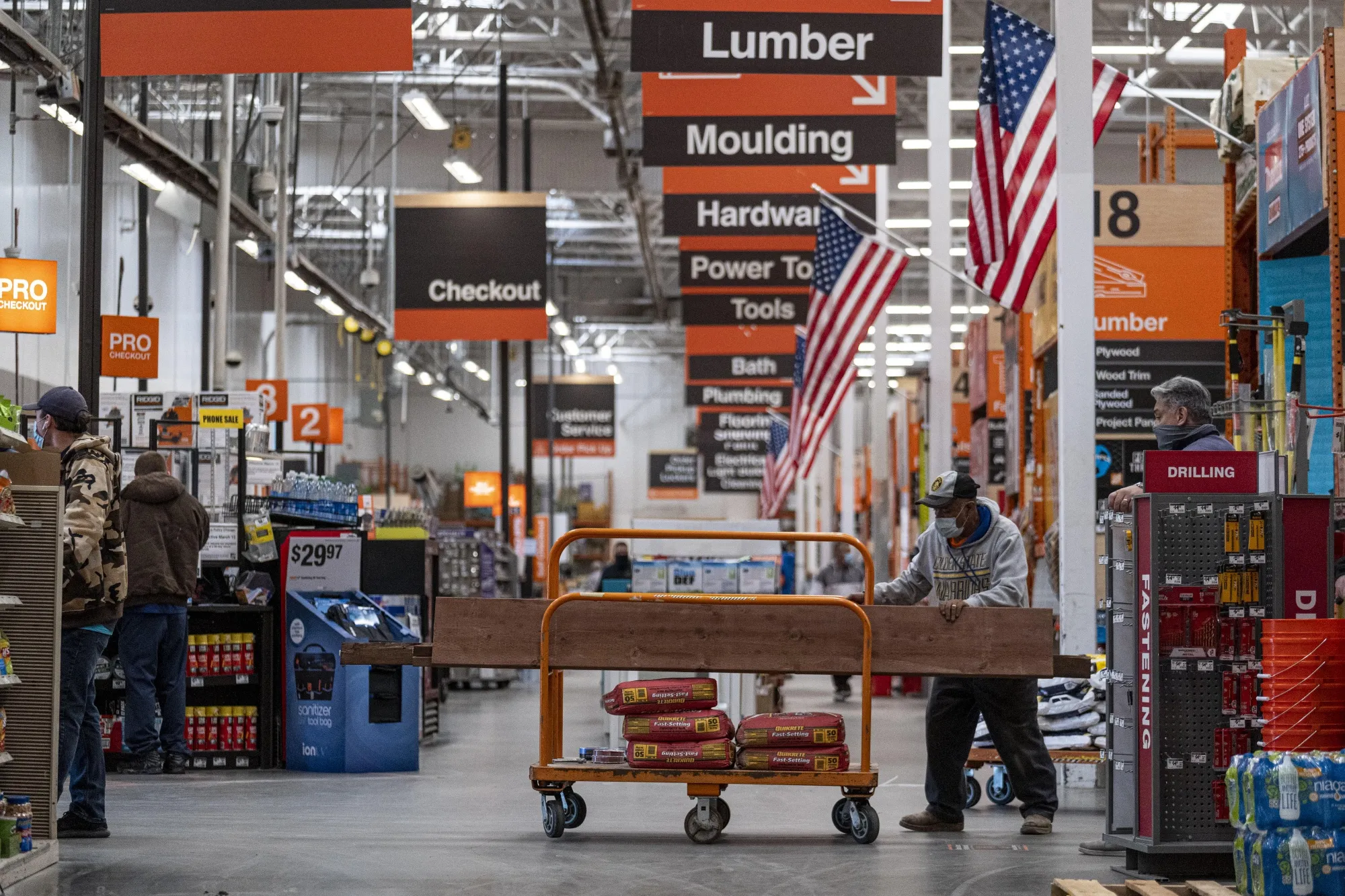 A shopper waits to check out at a Home Depot store in Pleasanton, California.