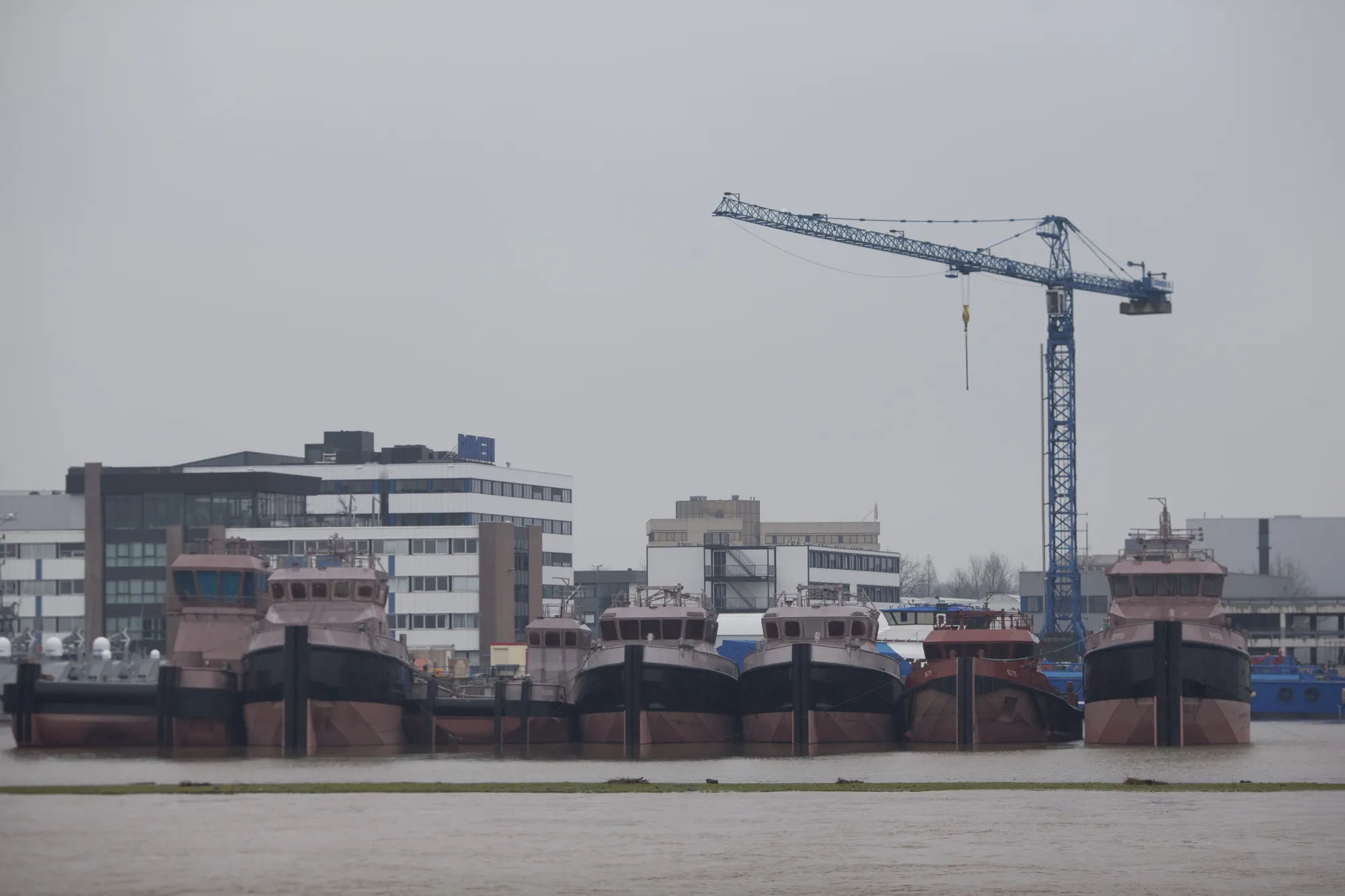 Boats sit docked beside a Damen shipyard in Gorinchem.