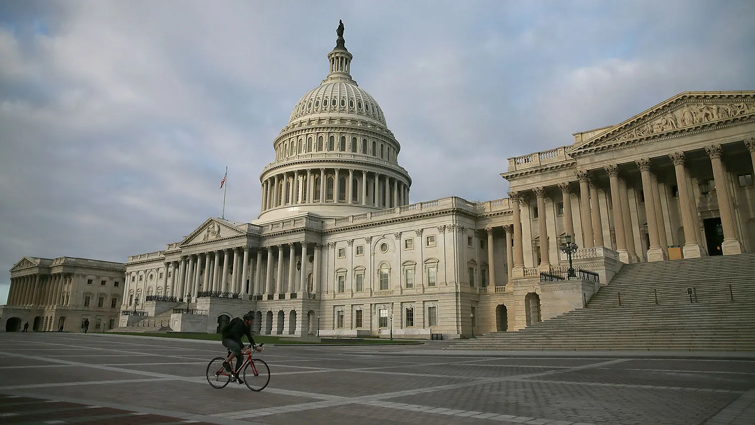 A biker rides past the U.S. Capitol , October 14, 2013 in Washington, DC.
