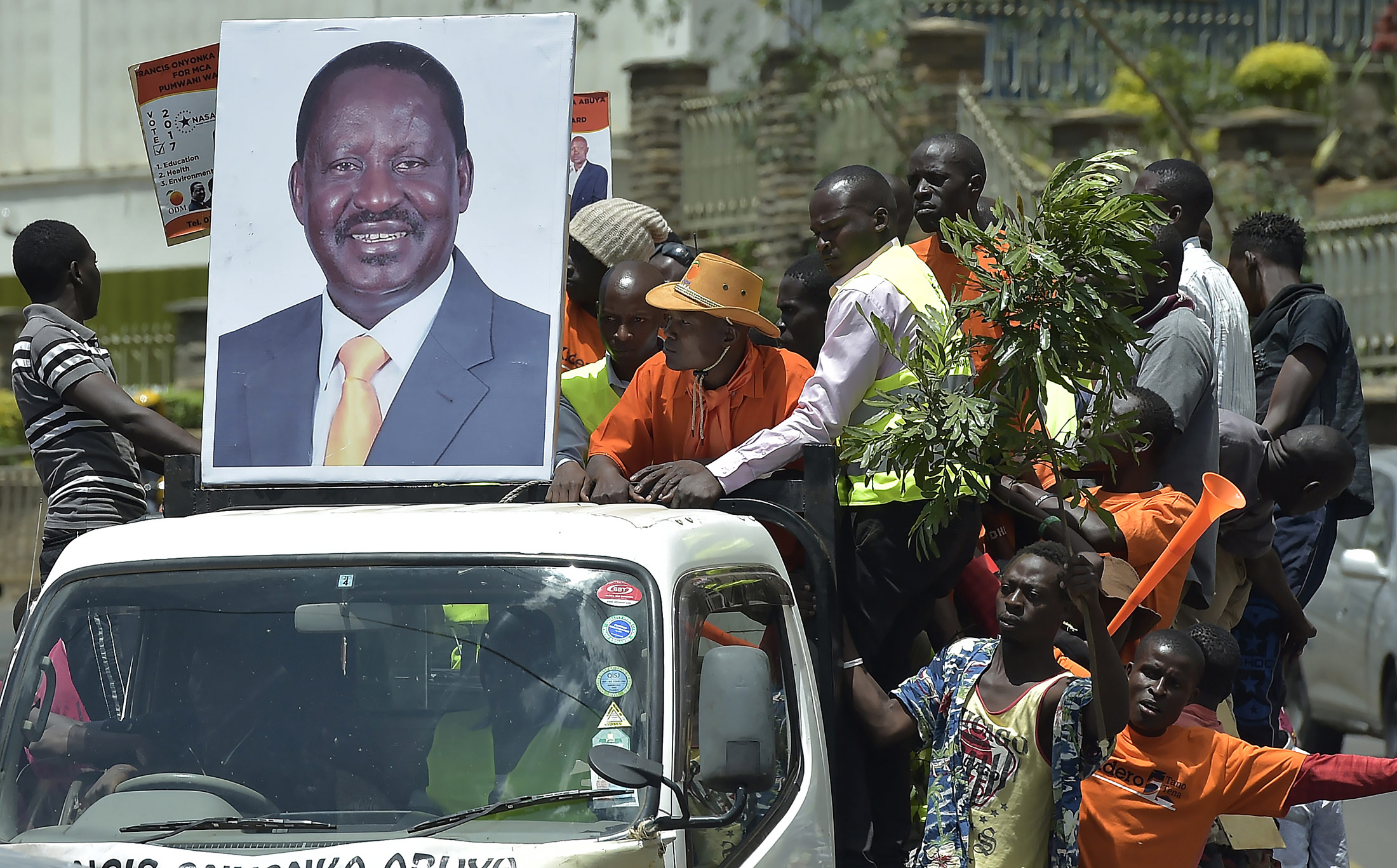 Supporters of the National Super Alliance (NASA) party hold a giant photo of the party's candidate Raila Odinga, in Nairobi
