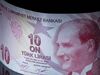 A 10 Turkish Lira banknote sits in this arranged photograph in London, U.K., on Wednesday, Aug. 15, 2018. Turkey took its boldest steps yet to try to ward off a financial crisis by making it harder for traders to bet against the battered lira and easing rules on restructuring troubled loans that have already topped $20 billion.