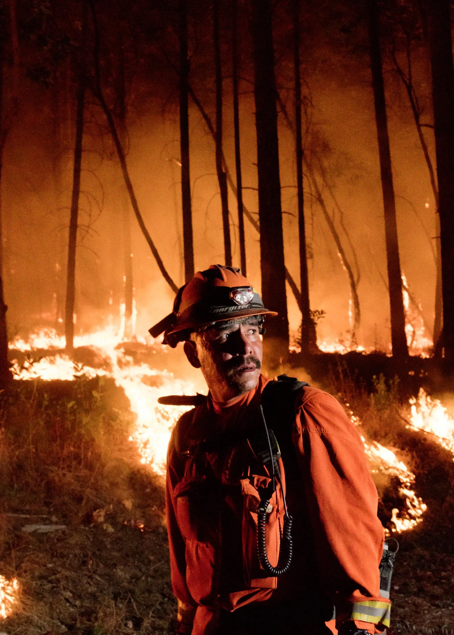 A California​ ​inmate​ ​firefighter&nbsp;during​ ​a​ ​backfiring​ ​operation​ ​in​ ​the​ ​hills of​ ​Oakmont​​ ​east​ ​of​ ​state Route ​12&nbsp;on Oct. 17, 2017.