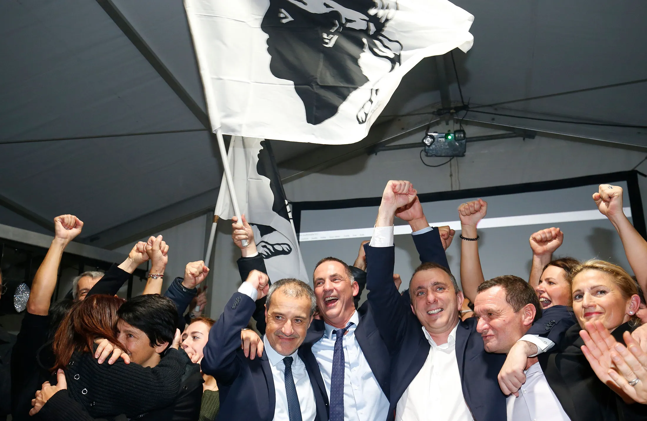 The Pe a Corsica nationalist party candidates celebrate&nbsp;celebrate after the announcement of the results in the territorial elections in Bastia on the French Mediterranean Island of Corsica.