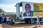 The face of Cyril Ramaphosa, South Africa's president, is displayed on the side of a campaign truck during a campaign event in Bloemfontein on April 7. 
