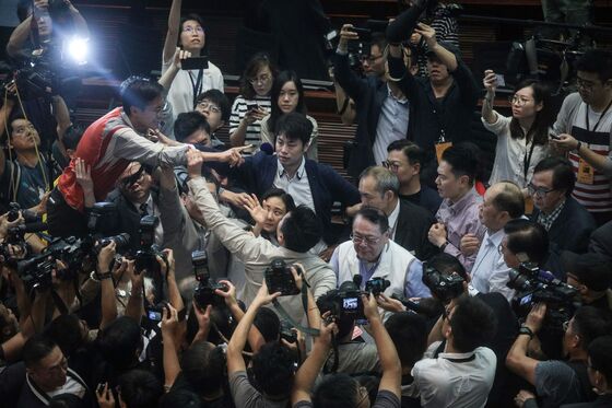 Hong Kong Lawmakers Told to Behave After Extradition Law Brawl