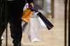 A shopper carries shopping bags in the Ginza district of Tokyo, Japan.