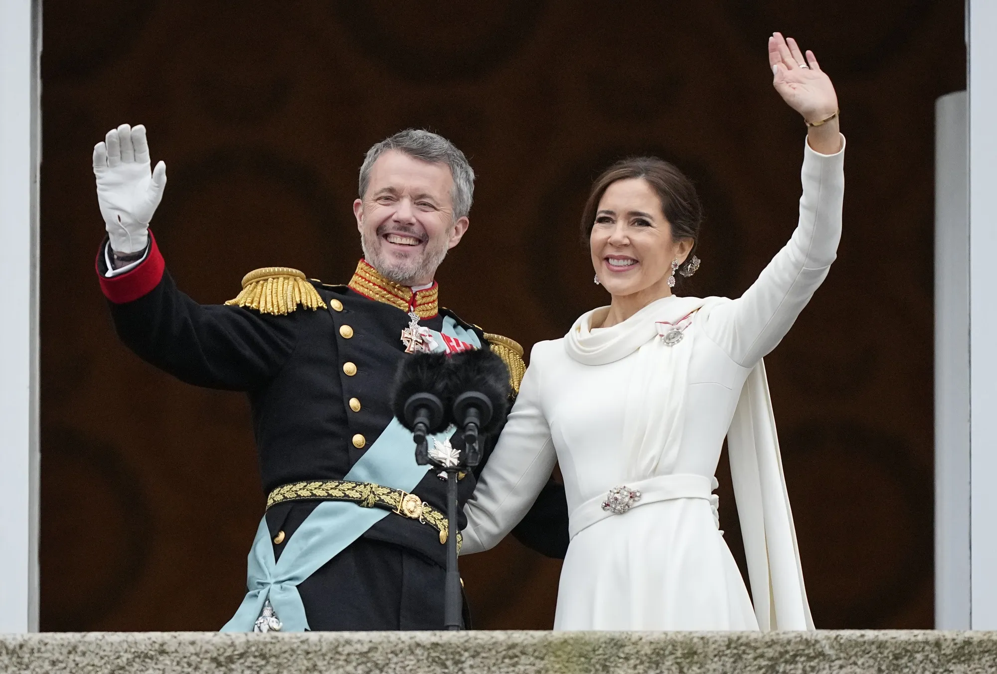 King Frederik X and Queen Mary wave from the balcony of Christiansborg Palace in Copenhagen, Jan. 14. 