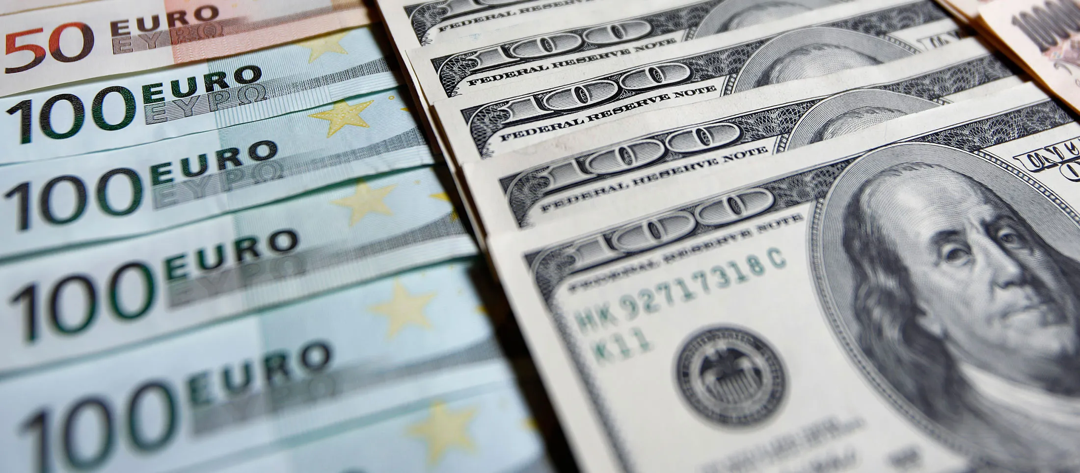 Euro, left, U.S. dollar, center, and yen banknotes of various denominations are arranged for a photograph in Soka City, Saitama Prefecture, Japan.