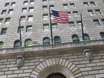 The U.S. flag hangs on the facade of the Federal Reserve Bank of New York headquarters in New York.