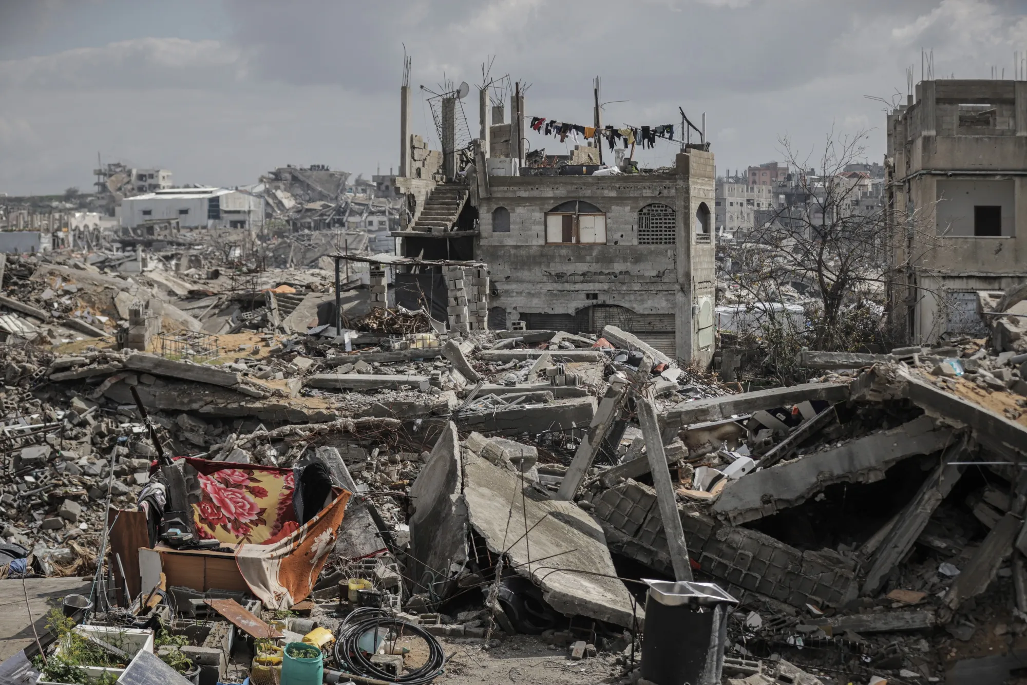 Displaced Palestinians living among destroyed buildings in the Jabaliya refugee camp, northern Gaza.