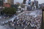 Demonstrators clash with riot police during a march against Venezuelan President Nicolas Maduro, in Caracas, Venezuela, on April 19, 2017.
