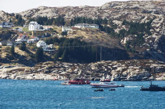 Rescue forces work at the shore west of Bergen, Norway after a helicopter crash
