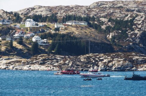 Rescue forces work at the shore west of Bergen, Norway after a helicopter crash