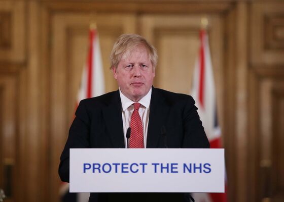 Johnson Threatens U.K. Lockdown as Public Ignores Virus Warnings