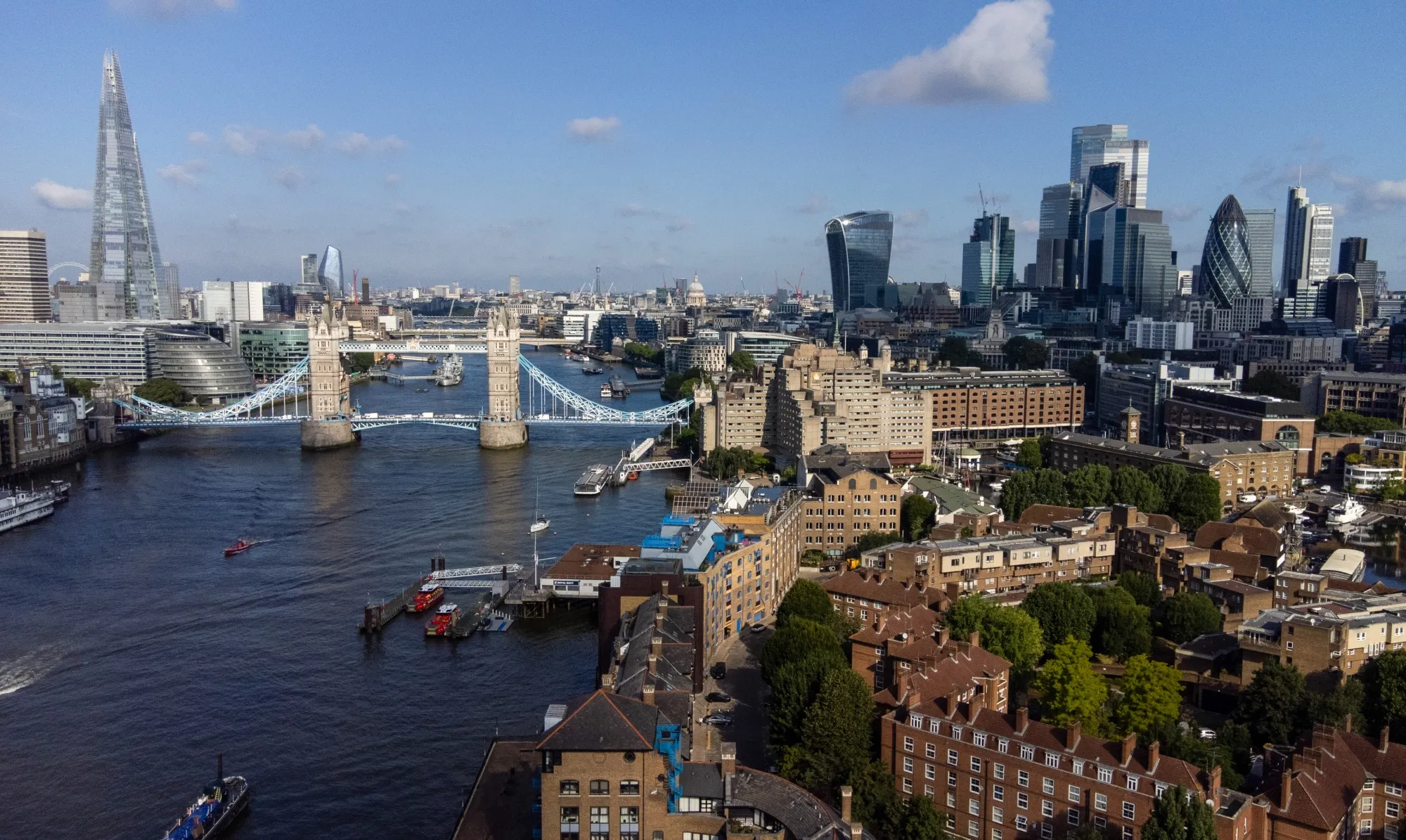 The Tower bridge next to skyscrapers in the Square Mile financial district of the City of London.