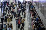 Commuters wearing protective masks walk through Hong Kong Station, in Hong Kong, China. 