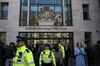 Metropolitan police officers stand beside the media outside the Westminster Magistrates' Court in London, U.K., on Thursday, April 11, 2019.
