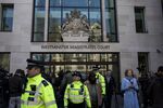 Metropolitan police officers stand beside the media outside the Westminster Magistrates' Court in London, U.K., on Thursday, April 11, 2019.