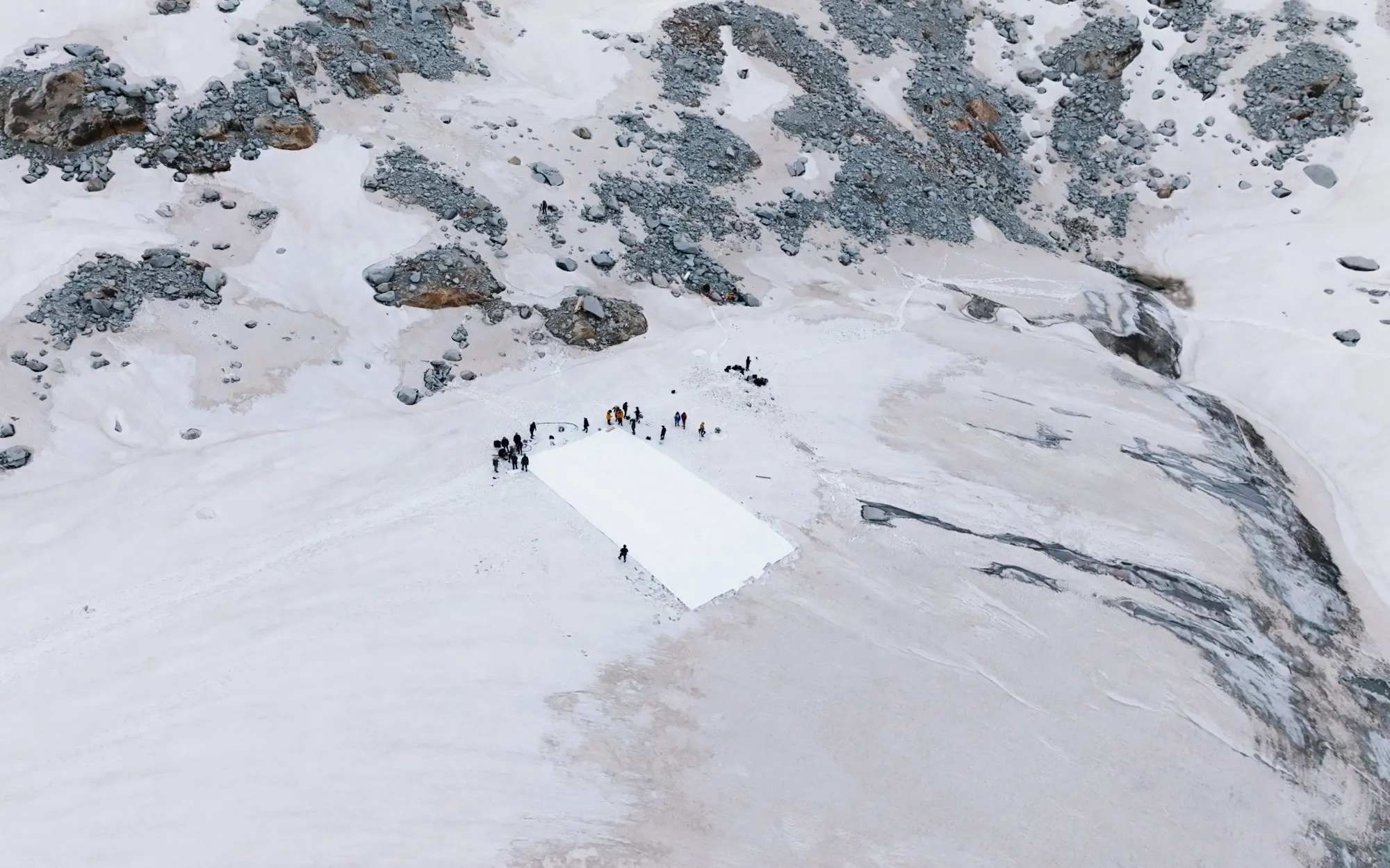 Scientists from Nanjing University cover part of the Dagu Glacier with sunlight-reflecting film on June 30.