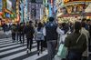 Young people flock to Tokyo’s Shinjuku district. Photographer: James Whitlow Delano/Bloomberg