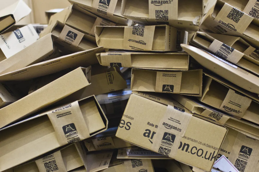 Cardboard packets containing customers' orders sit ahead of distribution inside an Amazon.es fulfilment center operated by Amazon.com Inc. in Alcala de Henares, Spain, on Wednesday, Aug. 13, 2014. Web-based platforms like Amazon.com Inc., eBay Inc. and Rakuten, Inc. have offered Spanish retailers a way to escape a domestic market hollowed out by five-year slump as they seek to re-wire their operations for the 21st century.
