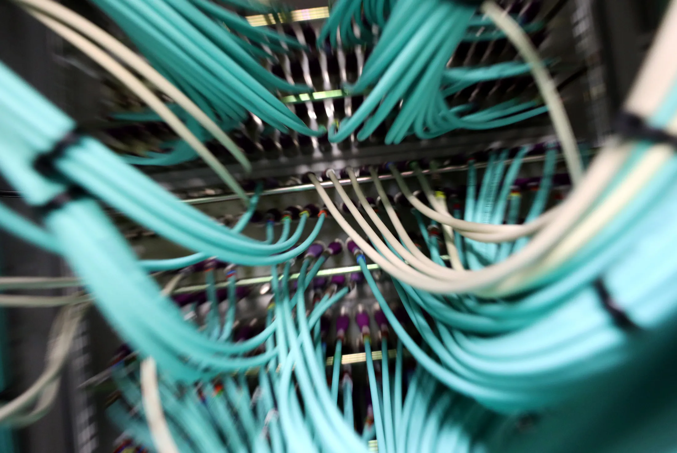 Data cables connect to a computer server unit inside a communications room at an office in London, U.K., on Monday, May 15, 2017. Governments and companies around the world began to gain the upper hand against the first wave of an unrivaled global cyberattack, even as the assault was poised to continue claiming victims this week.
