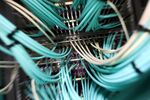 Data cables connect to a computer server unit inside a communications room at an office in London, U.K., on Monday, May 15, 2017. Governments and companies around the world began to gain the upper hand against the first wave of an unrivaled global cyberattack, even as the assault was poised to continue claiming victims this week.
