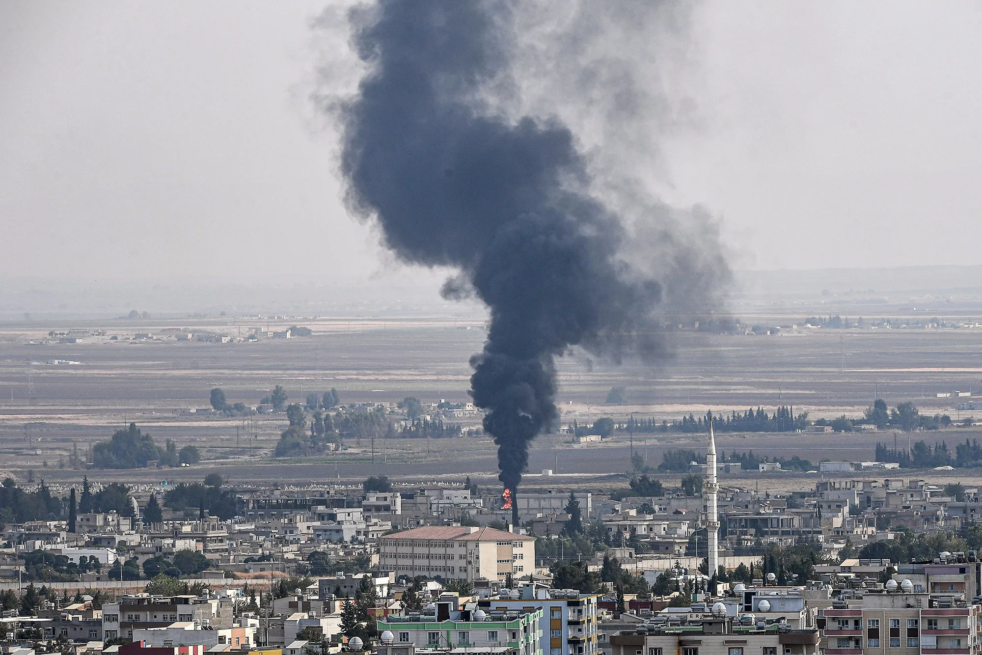 Smoke rises&nbsp;from the Syrian town of Ras al-Ain&nbsp;on Oct.&nbsp;18.&nbsp;