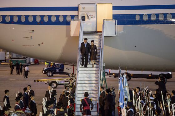 Xi Takes China’s Summit Style Abroad With Sea of Red Polo Shirts