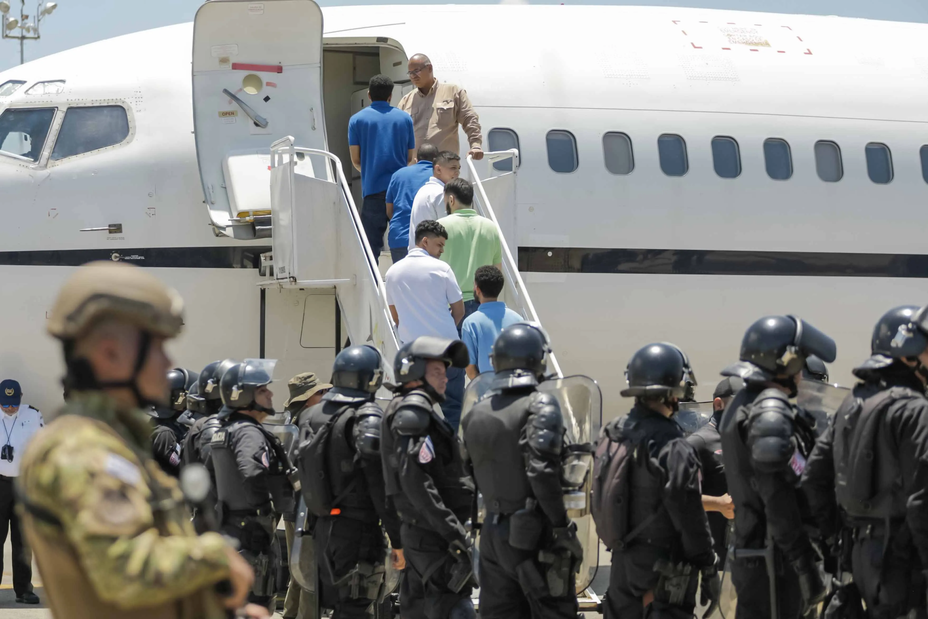 Detained Venezuelans board a flight to Venezuela&nbsp;as part of a detainee exchange agreement between Venezuela and United States on July 18, 2025 in La Paz, El Salvador. The Venezuelans had been sent to El Salvador in March 2025 after US President Donald Trump invoked the 1798 Alien Enemies Act, to deport presumed Tren de Aragua&nbsp;gang members without passing under normal immigration processes.