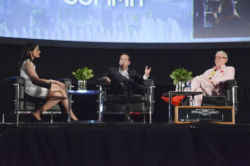 John Paulson (center) and Michael Tennenbaum (right) discuss their investments at the Puerto Rico Investment Summit. Source: Puerto Rico Investment Summit