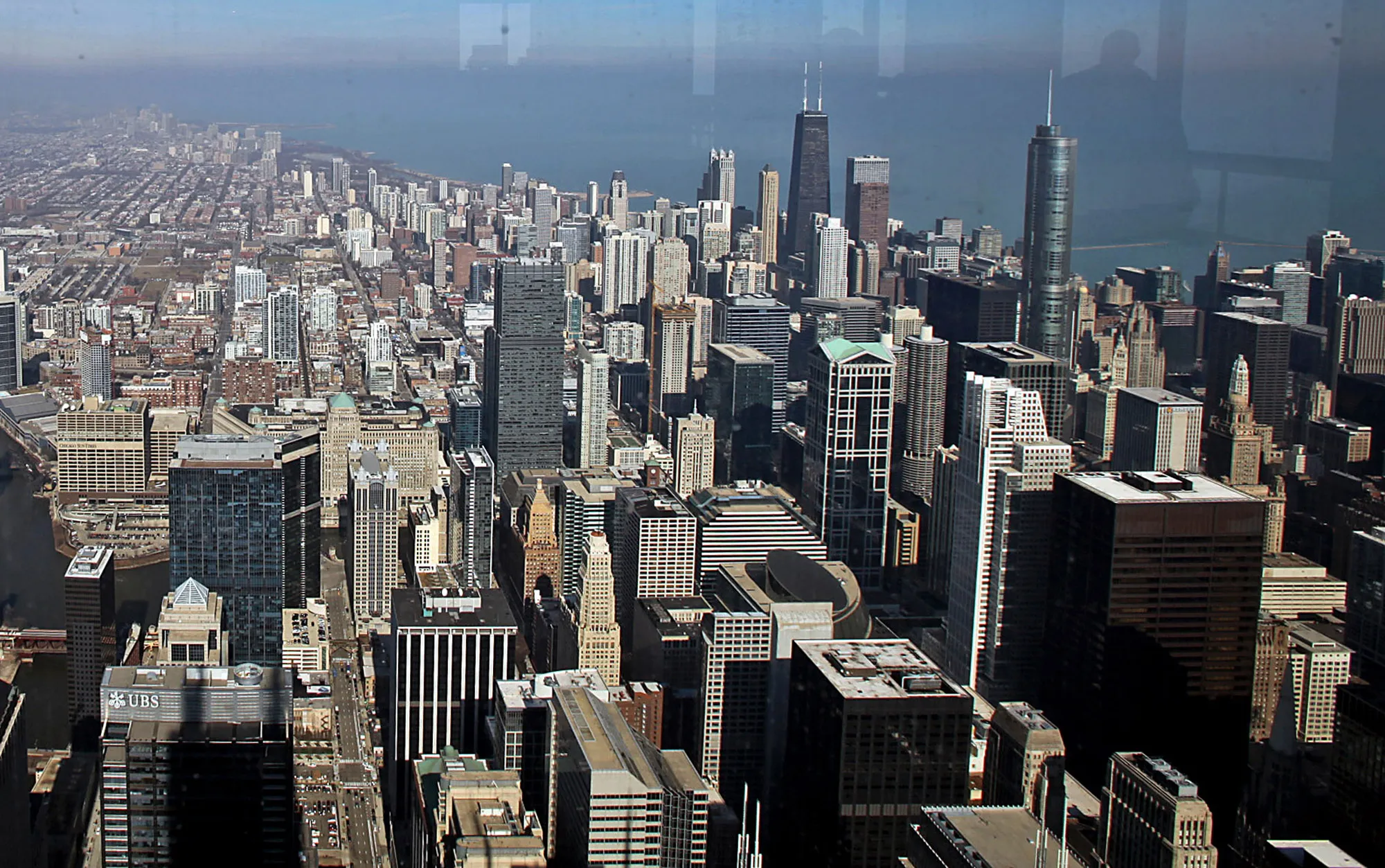Buildings stand in the cityscape as seen from the Willis Tower in Chicago.
