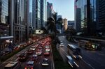 Vehicles travel along a road in Hong Kong on June 28.