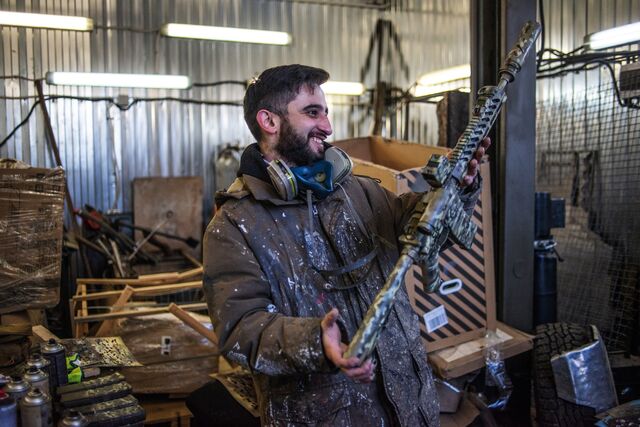 Sabir Mamedov, a graffiti artist before the war, and his friend Alik Mukhin, who tuned cars for racing, have spray painted camouflage onto thousands of rifles, mortar tubs and vehicles. 