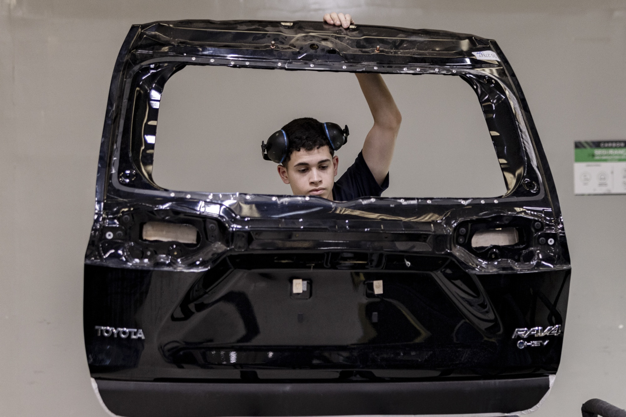 Employees of Carbon, Brazil's leading car armoring company, work at the factory in Sao Paulo, Brazil, on Tuesday, Nov. 18, 2025. Brazil is the world leader in car armoring, surpassing Mexico. Photographer: Victor Moriyama/Bloomberg
