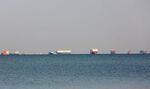 Commercial cargo and container ships ride anchor while waiting to transit the Suez Canal in Ismailia, Egypt, on March 25.