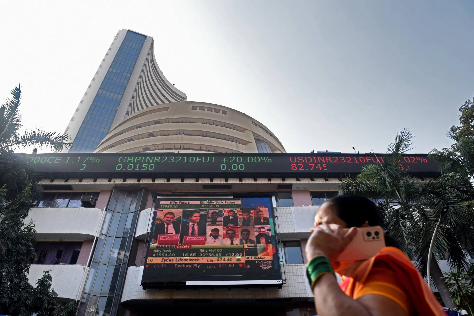 A news broadcast on the Adani Group outside the Bombay Stock Exchange (BSE) building in Mumbai, on Feb. 9.