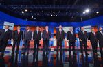 Republican presidential candidates arrive on stage for the Republican presidential debate on August 6, 2015 at the Quicken Loans Arena in Cleveland, Ohio.
