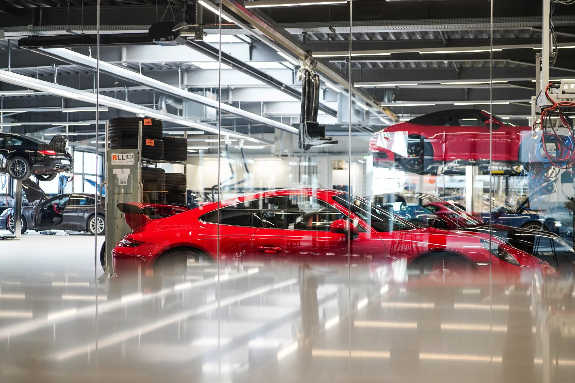A Porsche 911 luxury automobile in the service garage at a Porsche SE showroom in Dortmund, Germany.