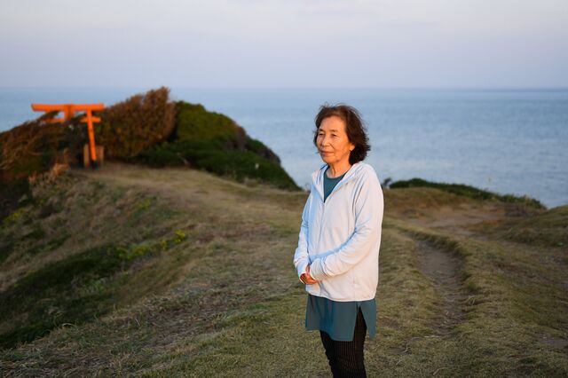 Hisae Takeo, an Ama diver stands at Sakyobana where she often visit with her husband to pray before and after the fishing season. Iki Island in Nagasaki Prefecture, Japan on Wednesday October 27, 2021.