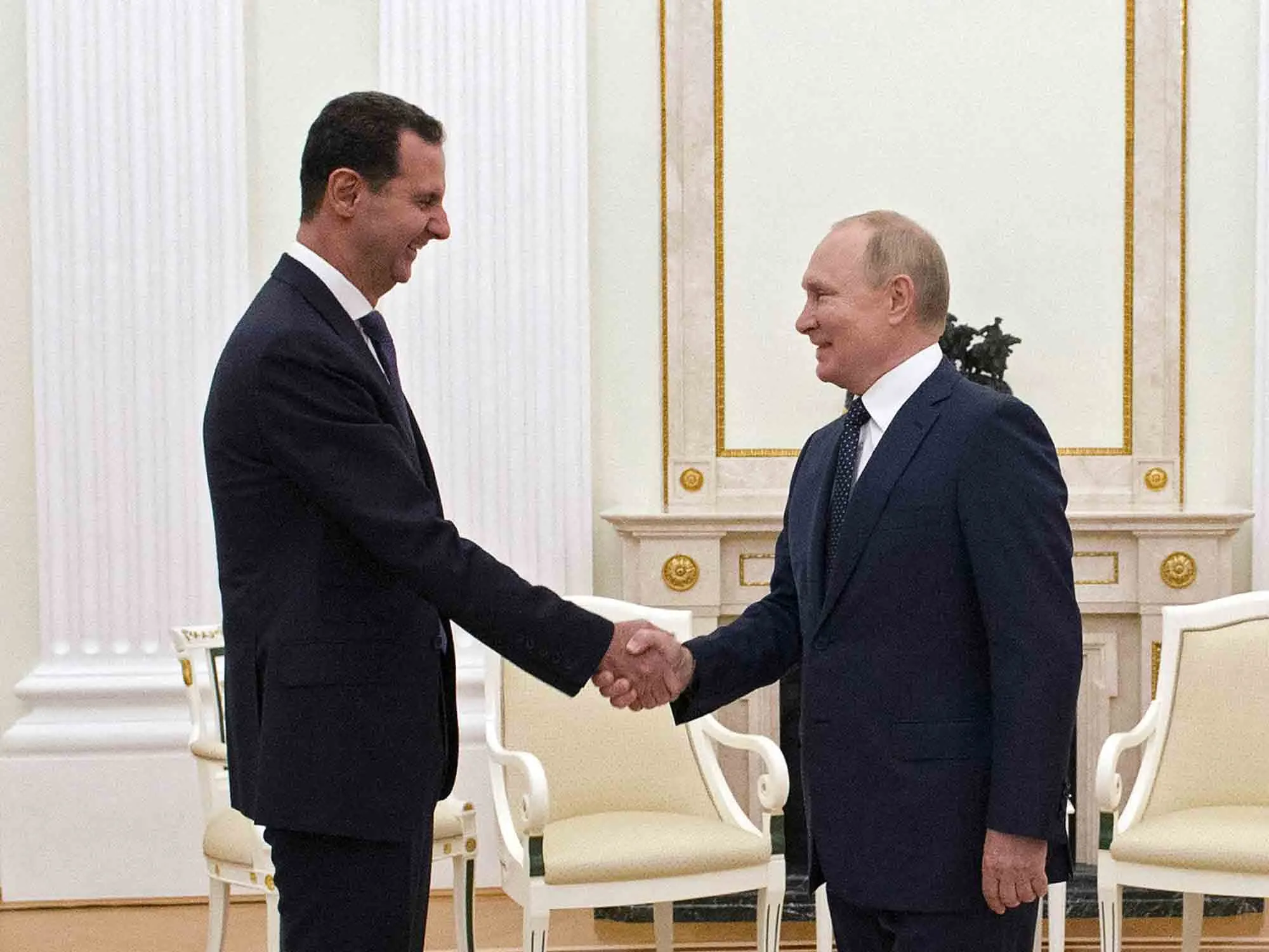 Vladimir Putin greets Bashar al-Assad at the Kremlin in Moscow, on Sept. 13.