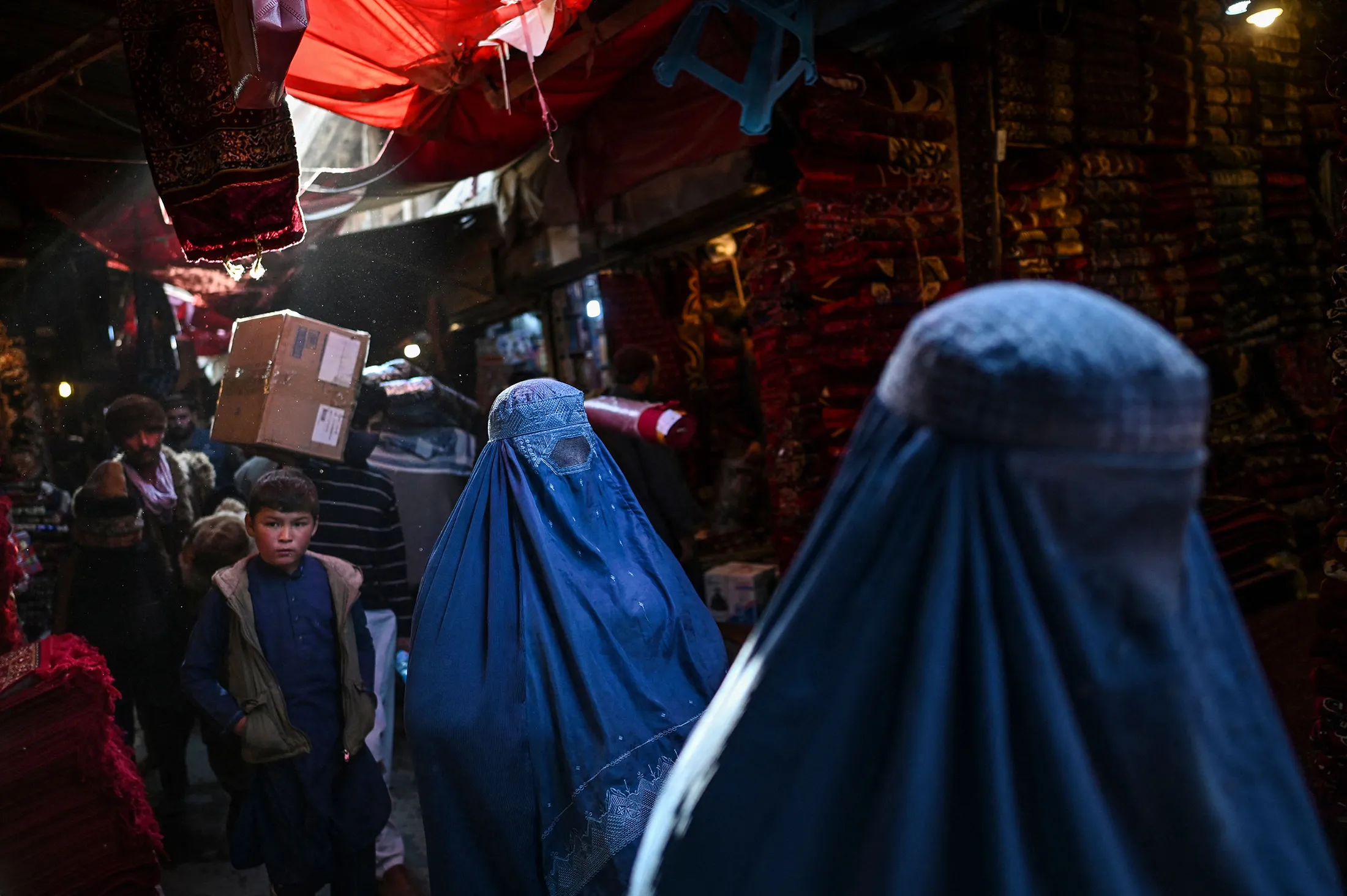 &nbsp;Burqa-clad women in a market in Kabul.