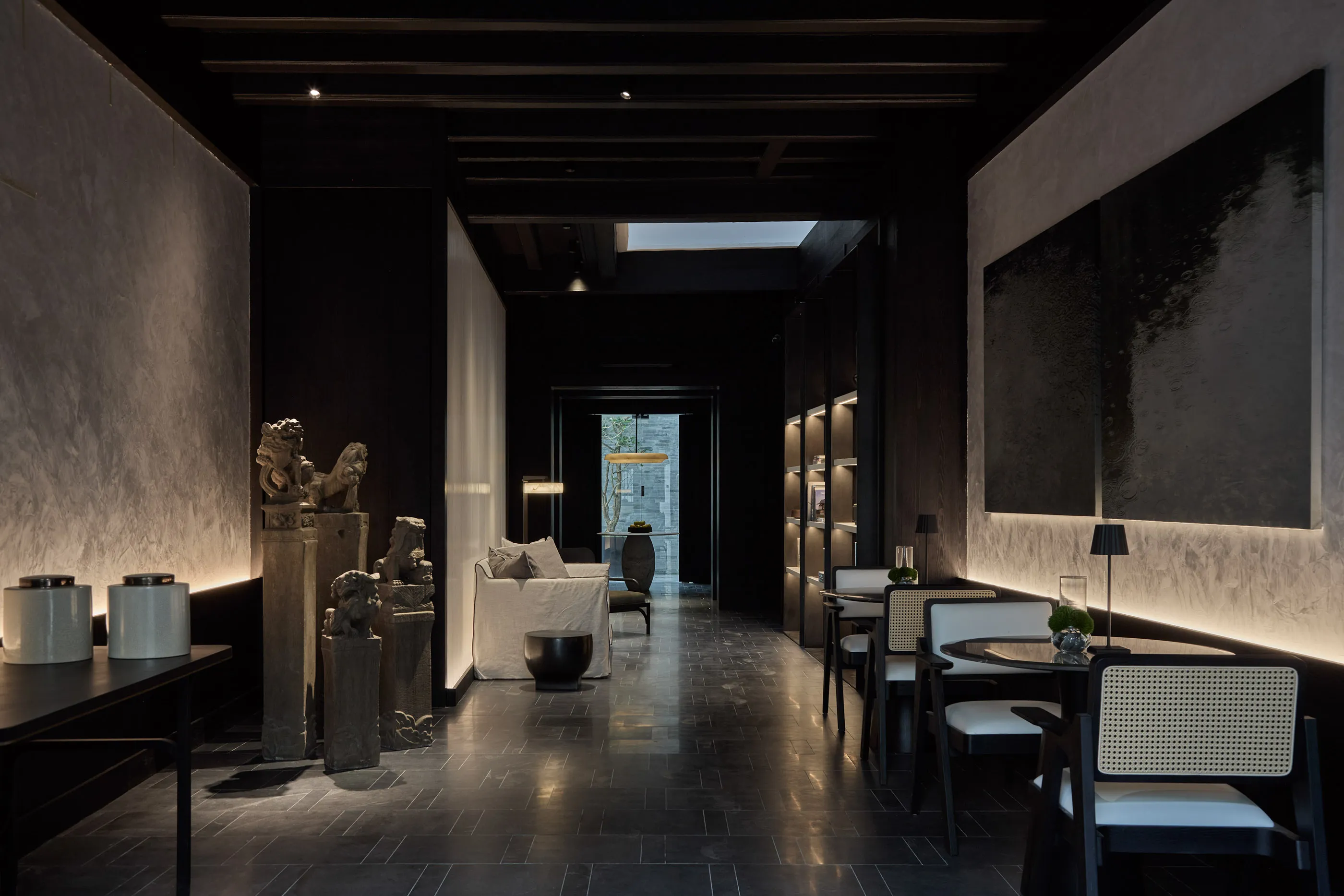 The restaurant at the soon-to-open Soori Penang hotel with its moody, black-and-white interiors.