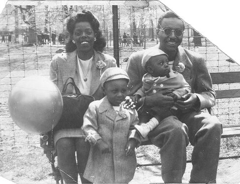 Dorothy and Boyd Mallett with Ron on the left and his younger brother, James, on the right, at the Bronx Park in 1948.